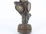 a gas mask that is sitting on top of a table