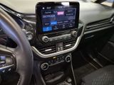 the interior of a car with a steering wheel, dashboard, and display screen