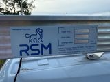 a sign on the roof of a car that says rsm