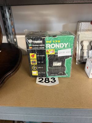 a box of radio sitting on a shelf next to a guitar