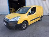the yellow van is parked in front of a building