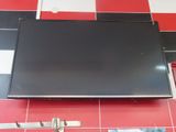 a flat screen tv mounted on a red and white tiled wall