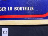 a sign that says gerla boutelle on the side of a table
