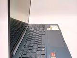 a laptop that is open on a white surface