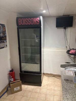 an image of a room with a refrigerator in it