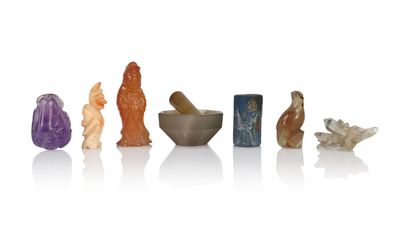 a group of small figurines of different shapes and sizes