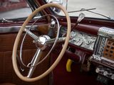 steering wheel and dashboard of a classic car in a parking lot