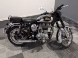 a motorcycle that is sitting on a checkered floor