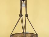 a close up of a chandelier hanging from a yellow wall
