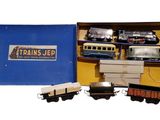 a box with a train set in it on a white surface