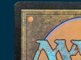 a close up of the magic the gathering logo on the back of a card