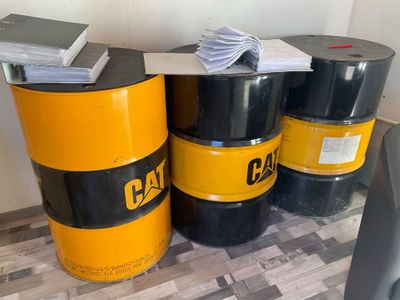 three barrels sitting next to each other on the floor