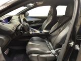 the interior of a car with the door open and the seats down