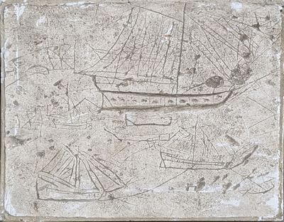 a picture of a stone with a drawing of a boat on it