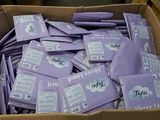 a cardboard box filled with purple packets of toilet paper