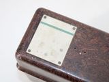 an old radio sitting on a table with a white background