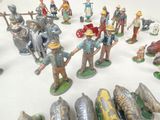 many figurines of people that are standing in a circle