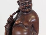 a statue of a man with a bag on his shoulder
