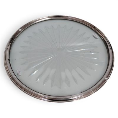 a silver plate with a circular design on it