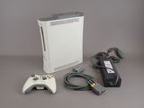 a video game console with a controller and a charger