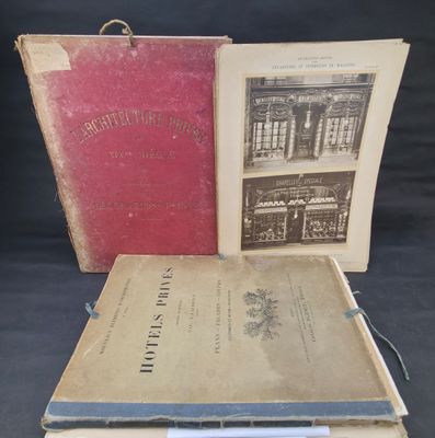 two old books sitting on top of each other on a table