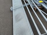 a lot of steel bars and other metal items on the ground