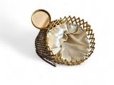 an image of a basket with a gold handle and a white satin lining