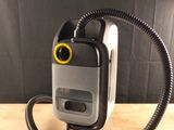 an image of a cell phone that is connected to a cord