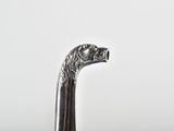 a close up of a walking stick with a horse head on it