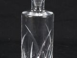 an image of a glass decanter on a black background
