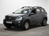 une photo d'une Dacia grise garée dans une pièce