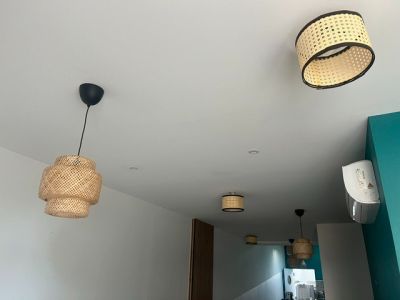 two lamps hanging from the ceiling in a room