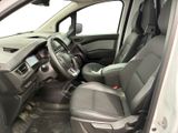the interior of a car with the driver ' s seat folded down