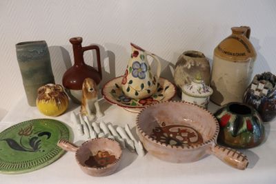 many different types of pottery on the table