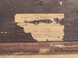 a piece of paper on the bottom of a wooden box