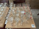 a lot of empty wine glasses sitting on a table
