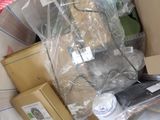 a box full of items that are sitting on a bed