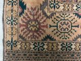 a close up of a rug on a white surface