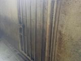 a radiator in the corner of a room with a window