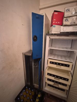 a refrigerator that has a bunch of bottles in it
