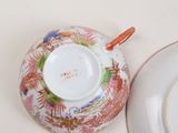 a plate and a cup sitting on a table