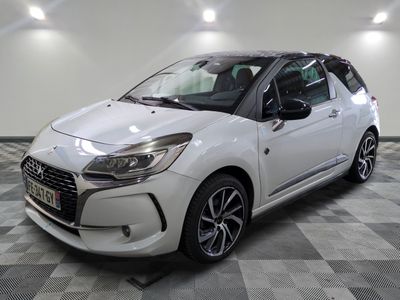 the white citrole is parked on a checkered floor