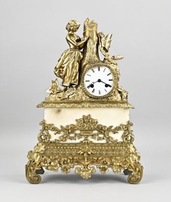 an antique clock with a statue of a man and a woman on top of it