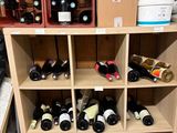 many bottles of wine on the shelves in the store