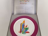 a plate with a picture of a city on it in a box