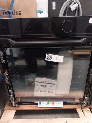 an image of a microwave oven sitting on top of a pallet