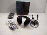 a box of headphones sitting on a table next to a pair of earphones