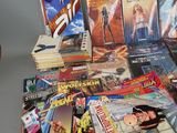 a lot of comic books sitting on a table