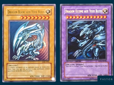 two cards of a dragon and a white dragon are on a blue background