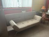 a couch that is sitting in the corner of a room